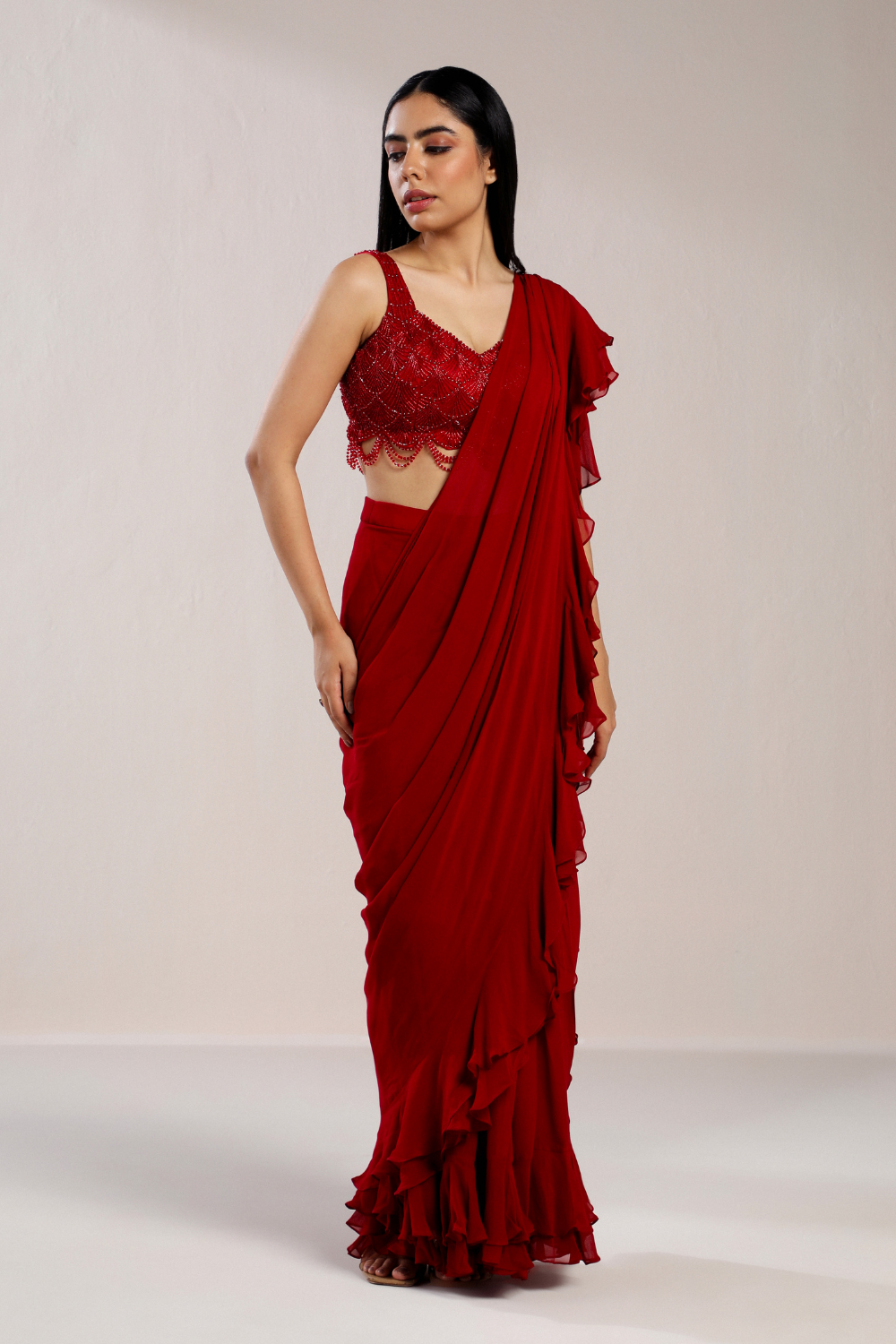 RED RUFFLE SAREE WITH EMBROIDERED CRYSTAL BLOUSE