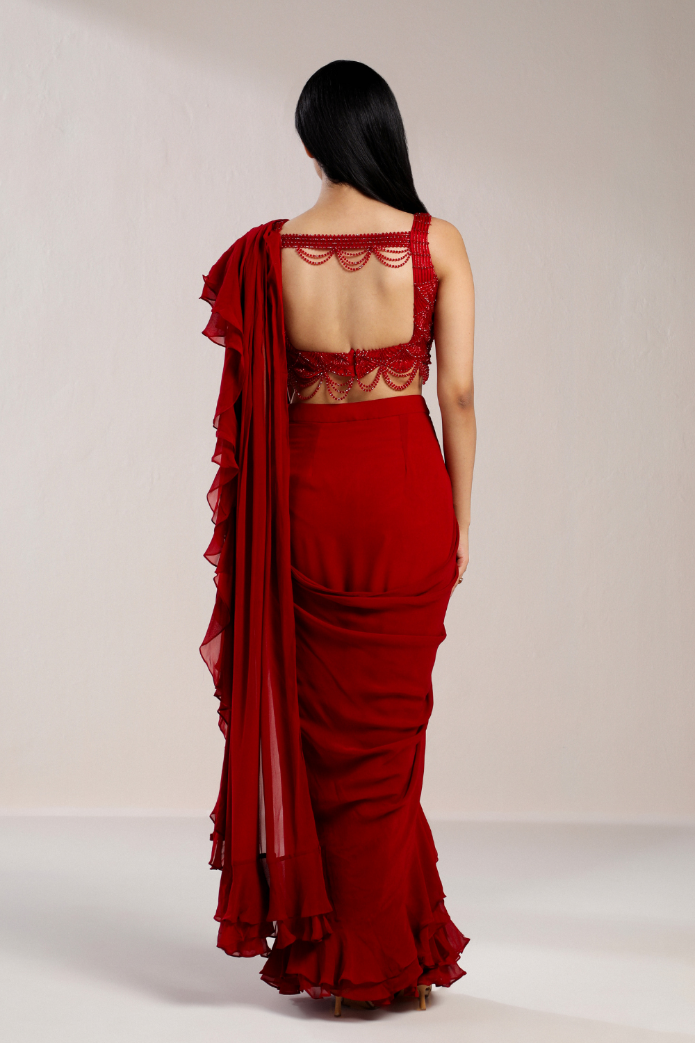 RED RUFFLE SAREE WITH EMBROIDERED CRYSTAL BLOUSE